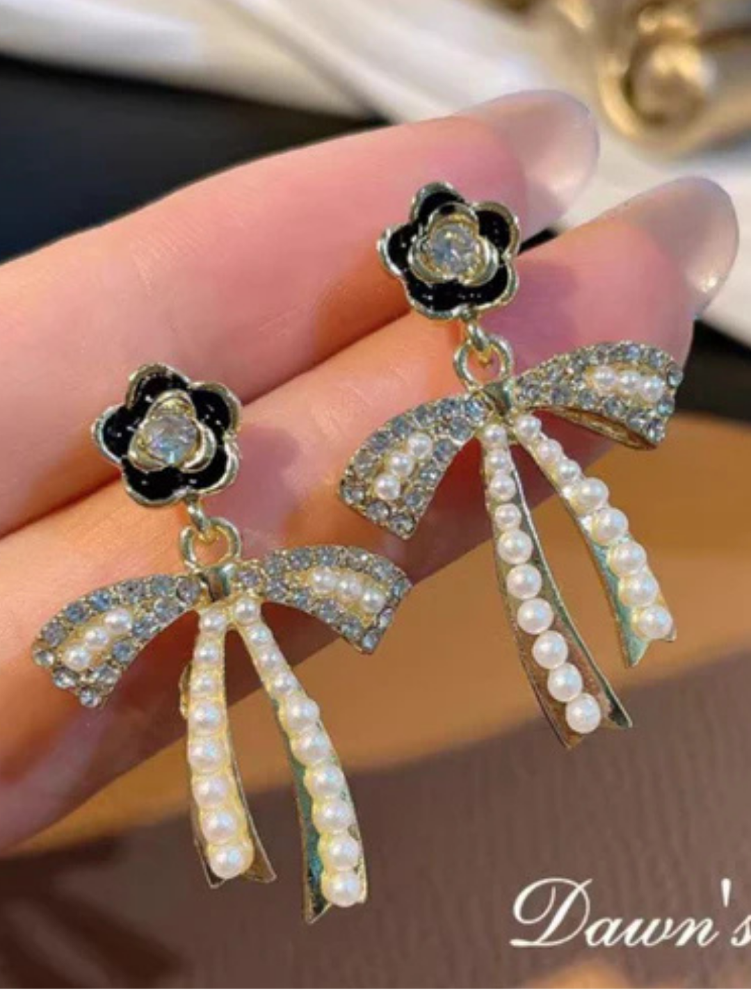 Glossy black enamel flower earrings with dangling pearls