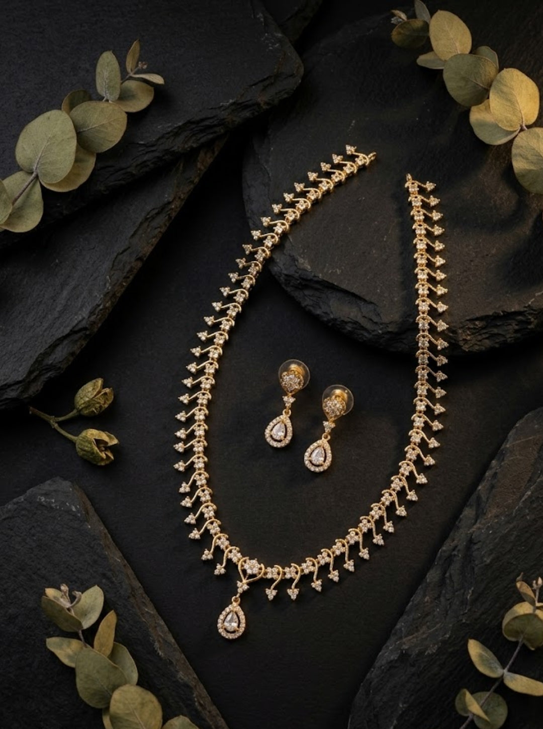 South Indian-inspired statement necklace with intricate floral detailing and a sparkling drop pendant.