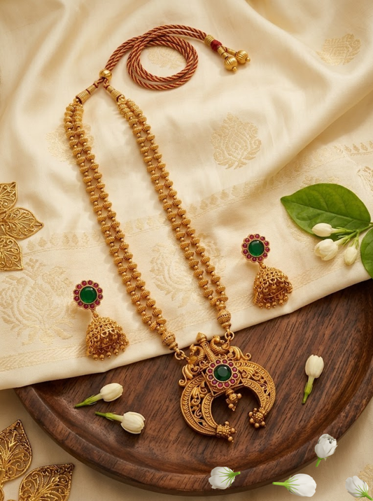 Antique gold peacock necklace set with green and ruby stones and jhumka earrings