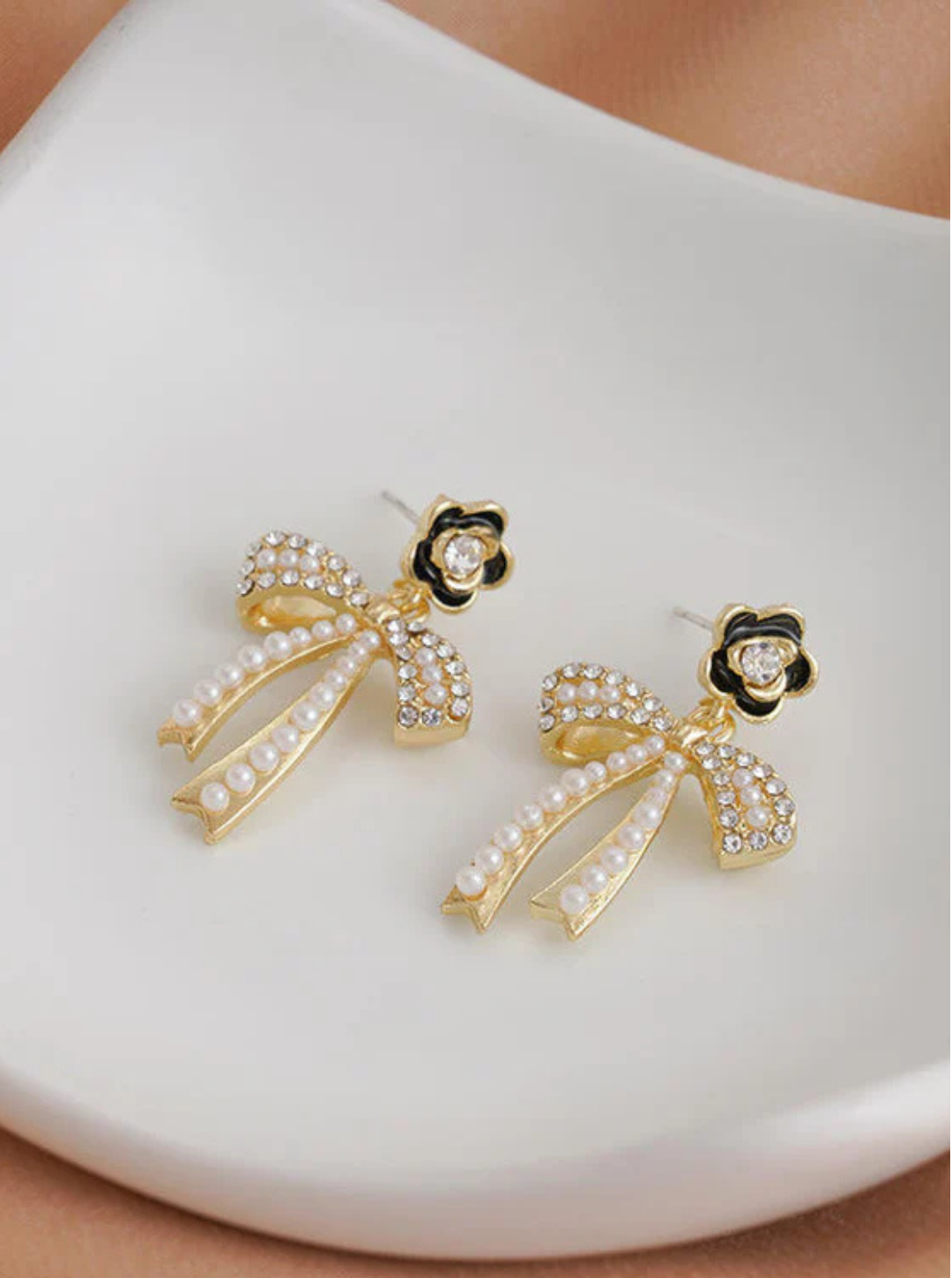 Vintage-style pearl bow drop earrings with floral top