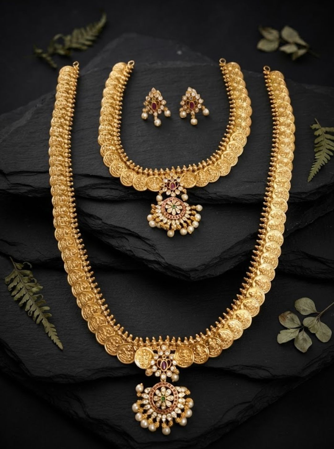 South Indian coin-style necklace featuring repeated circular motifs and a detailed floral pendant.