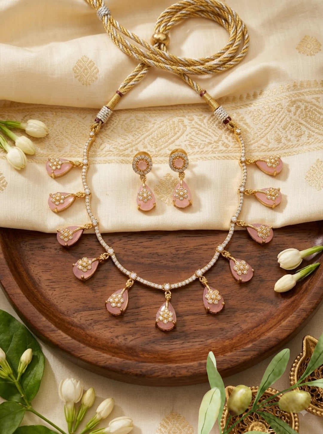 Colourful South Indian-inspired necklace collection with pink, blue and ruby teardrop pendants and matching earrings.