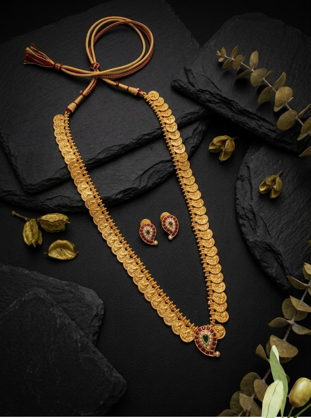 Classic bridal necklace set with intricate coin detailing, colourful gemstone pendant and matching traditional earrings.