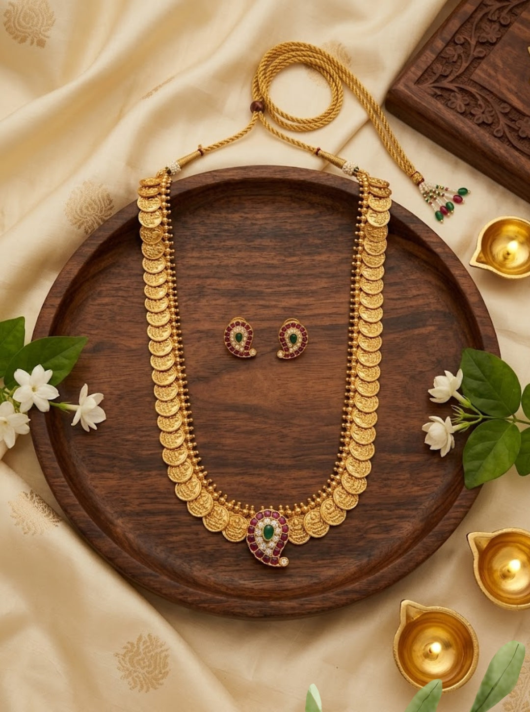 Traditional South Indian gold coin Kasu necklace with a mango paisley pendant.